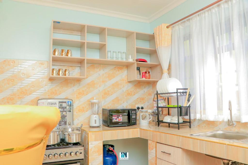 Kuchyň nebo kuchyňský kout v ubytování Neim Homes