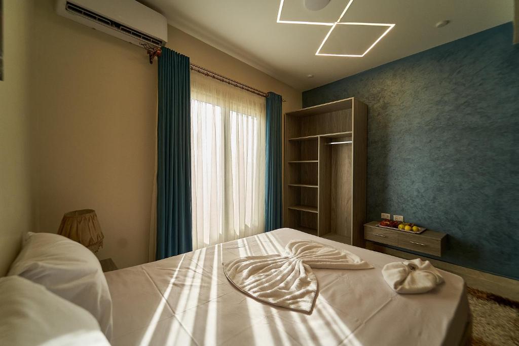 Postel nebo postele na pokoji v ubytování New pyramids inn