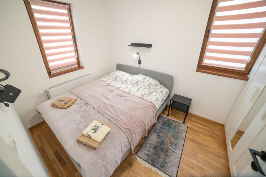 A bed or beds in a room at Divčinova S4