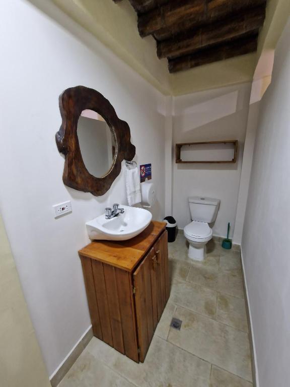 a bathroom with a sink and a toilet at Bhutan Filandia in Filandia