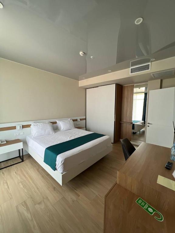 Voodi või voodid majutusasutuse Ritsa Resort toas