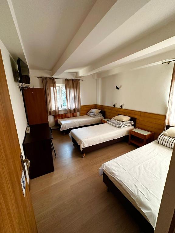 Posteľ alebo postele v izbe v ubytovaní Hostel Tolek