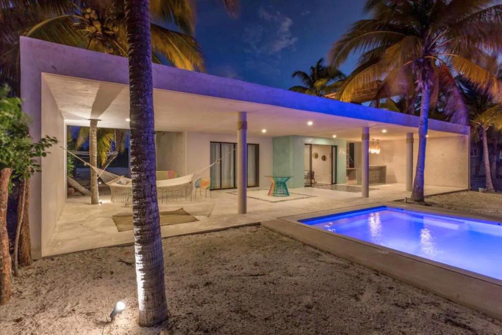 an exterior view of a house with a swimming pool at San Crisanto Beachfront Villa with Private Pool and Ocean View in San Crisanto