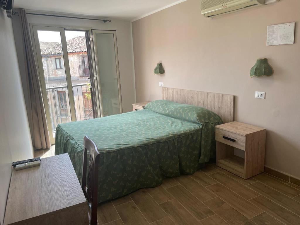 Postel nebo postele na pokoji v ubytování Hotel Cortese