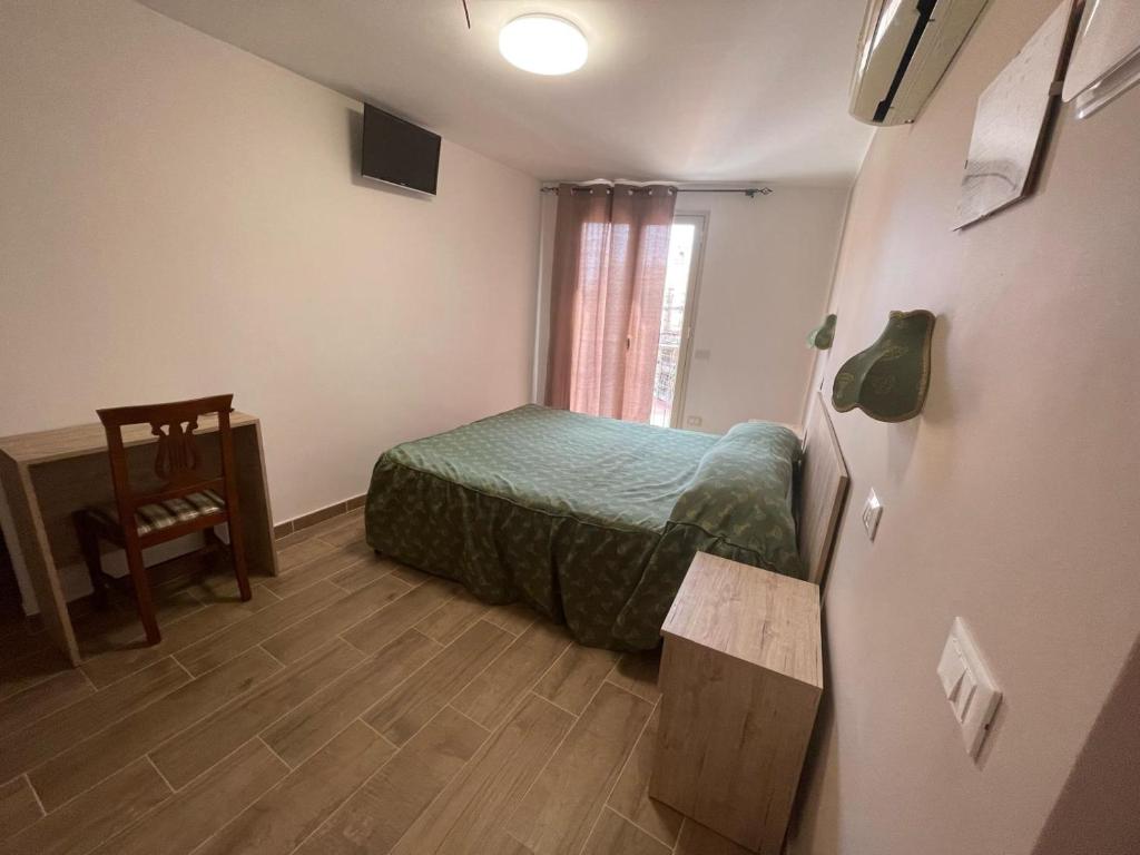 Postel nebo postele na pokoji v ubytování Hotel Cortese