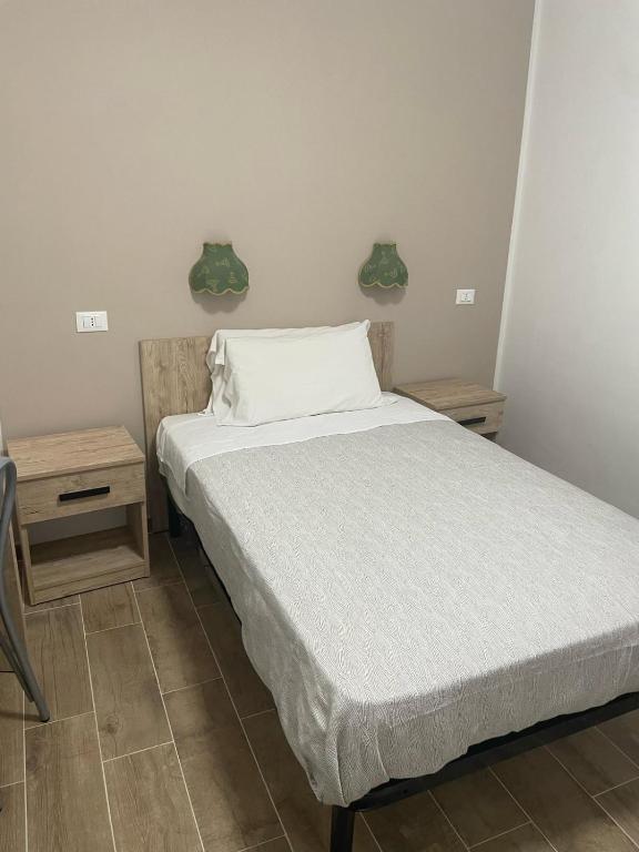 Postel nebo postele na pokoji v ubytování Hotel Cortese