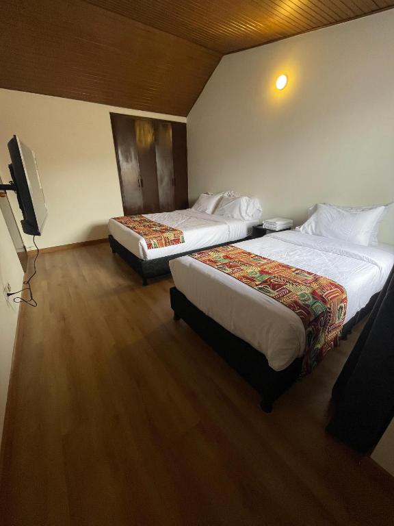 Postel nebo postele na pokoji v ubytování Bamuka Hostal