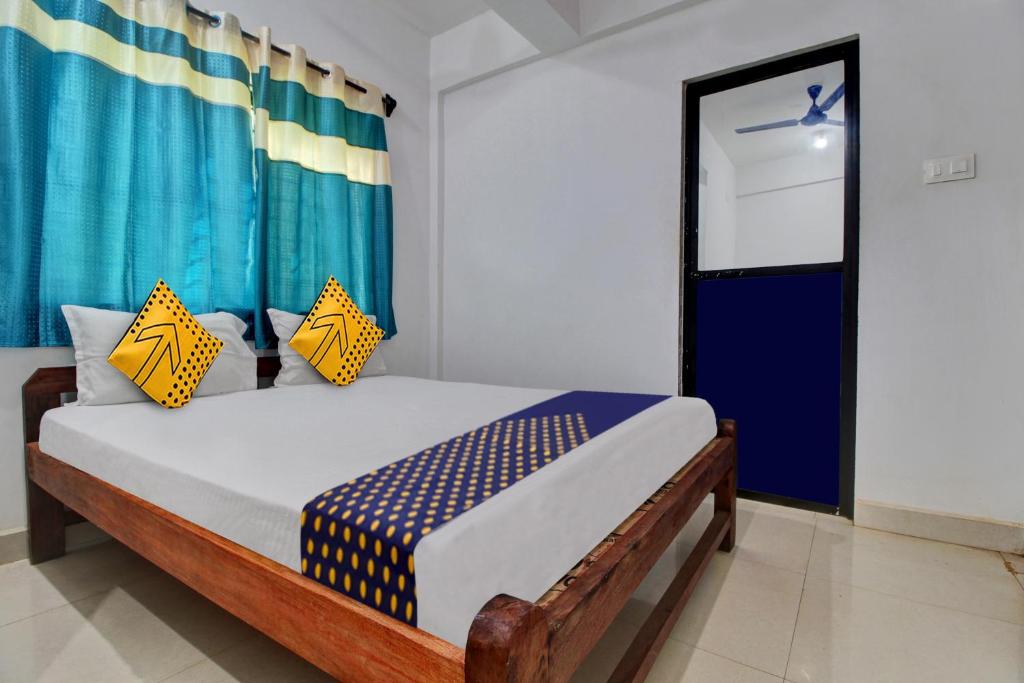 Postel nebo postele na pokoji v ubytování Hotel O U & I LIVINGS