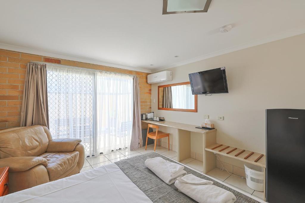 TV a/nebo společenská místnost v ubytování Emerald Central Palms Motel