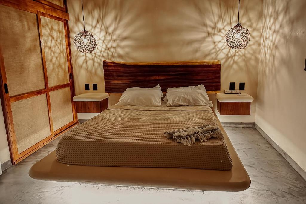 Postel nebo postele na pokoji v ubytování Casa Kobaab Tulum