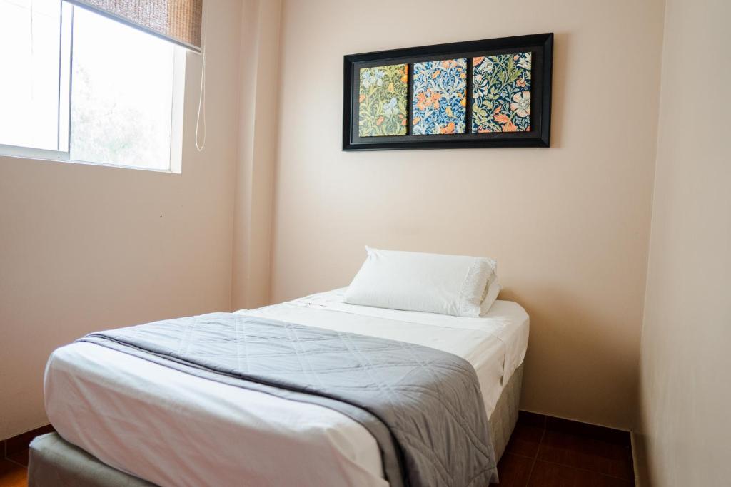Postel nebo postele na pokoji v ubytování TruGarden Hotel Trujillo