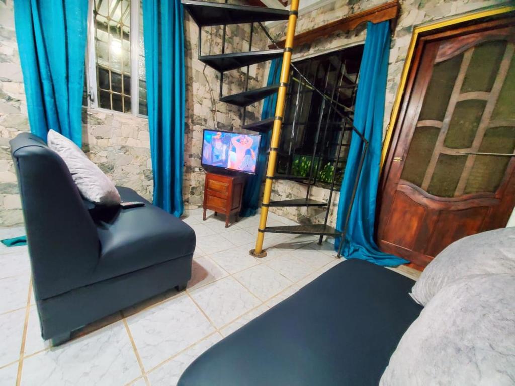 TV a/nebo společenská místnost v ubytování Cabaña monte de los olivos