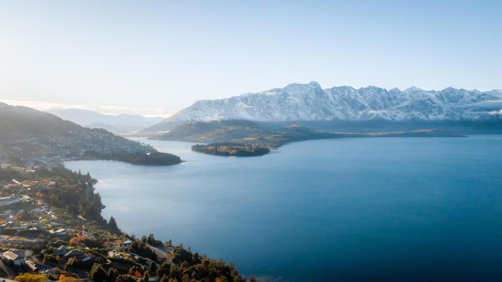 an aerial view of a large body of water with mountains at Ora Retreat in Queenstown
