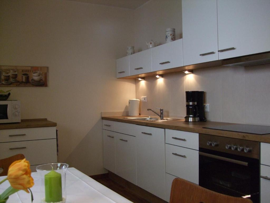 Kuchyň nebo kuchyňský kout v ubytování Haus Mittelberg