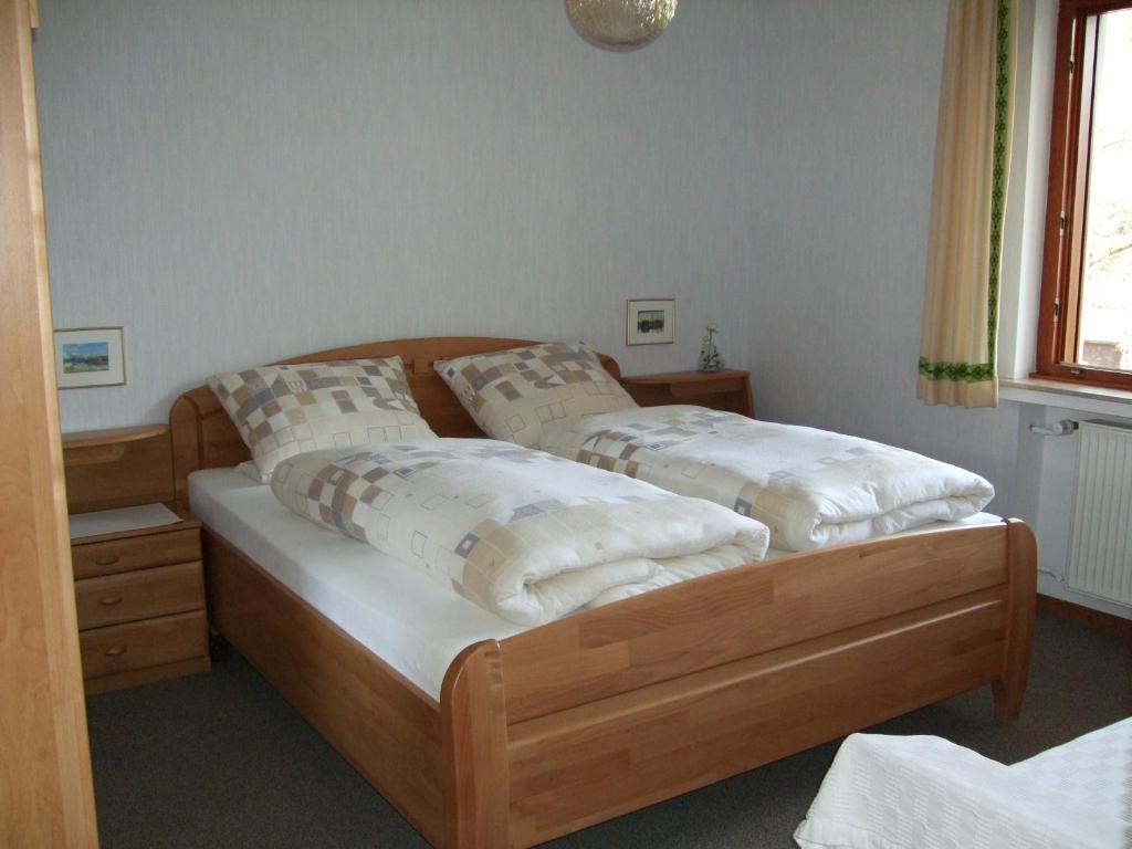 Postel nebo postele na pokoji v ubytování Haus Mittelberg