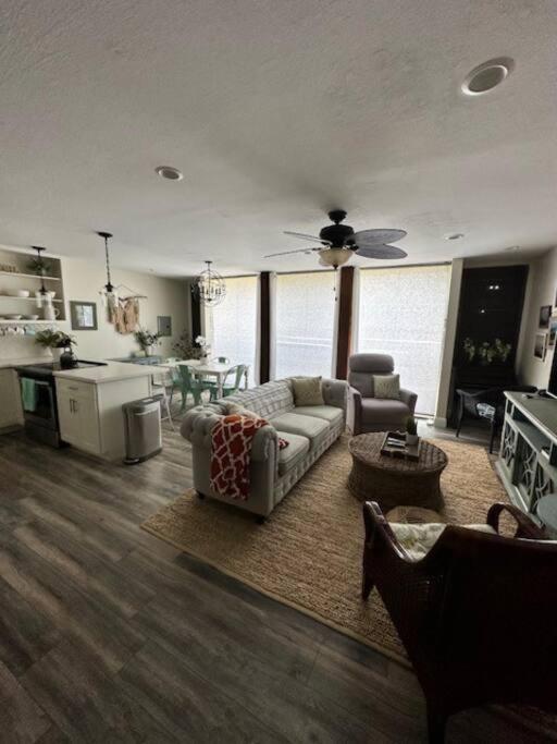 a living room with a couch and a table at Valley Vibes and Beach Bliss Condo for Family Nomads in Waianae