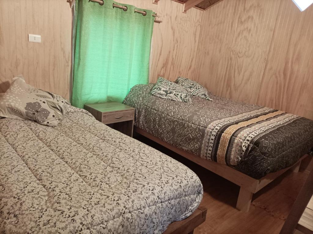 Postel nebo postele na pokoji v ubytování Cabaña Rancho JyC