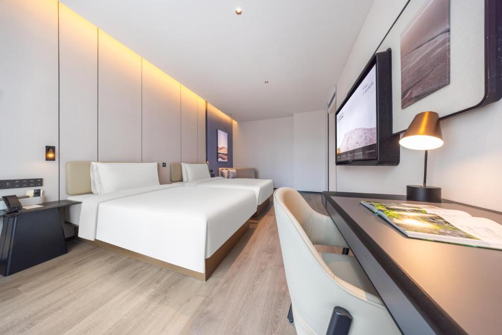 Postel nebo postele na pokoji v ubytování Atour Hotel Changsha Financial Center Chazishan Road