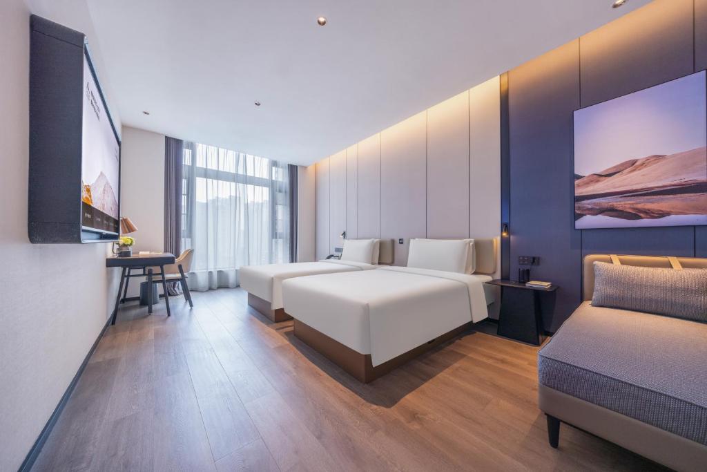 Postel nebo postele na pokoji v ubytování Atour Hotel Changsha Financial Center Chazishan Road