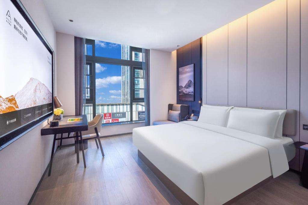 Postel nebo postele na pokoji v ubytování Atour Hotel Changsha Financial Center Chazishan Road