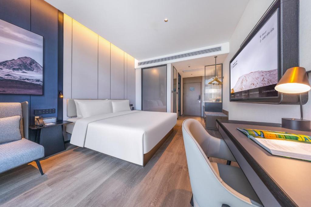 Postel nebo postele na pokoji v ubytování Atour Hotel Changsha Financial Center Chazishan Road