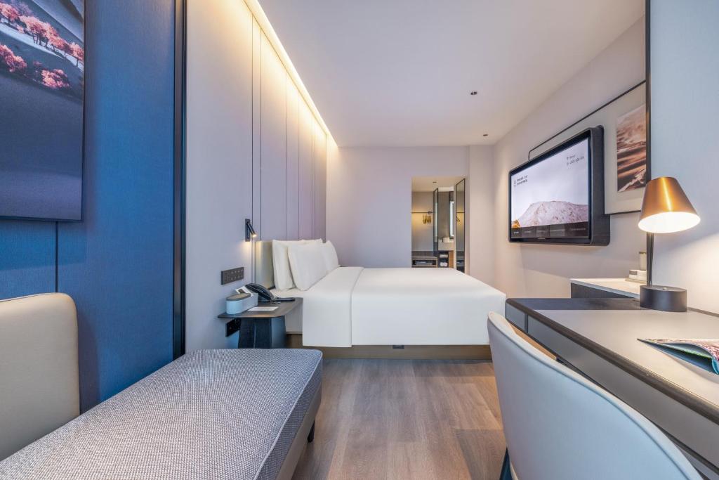 Postel nebo postele na pokoji v ubytování Atour Hotel Changsha Financial Center Chazishan Road