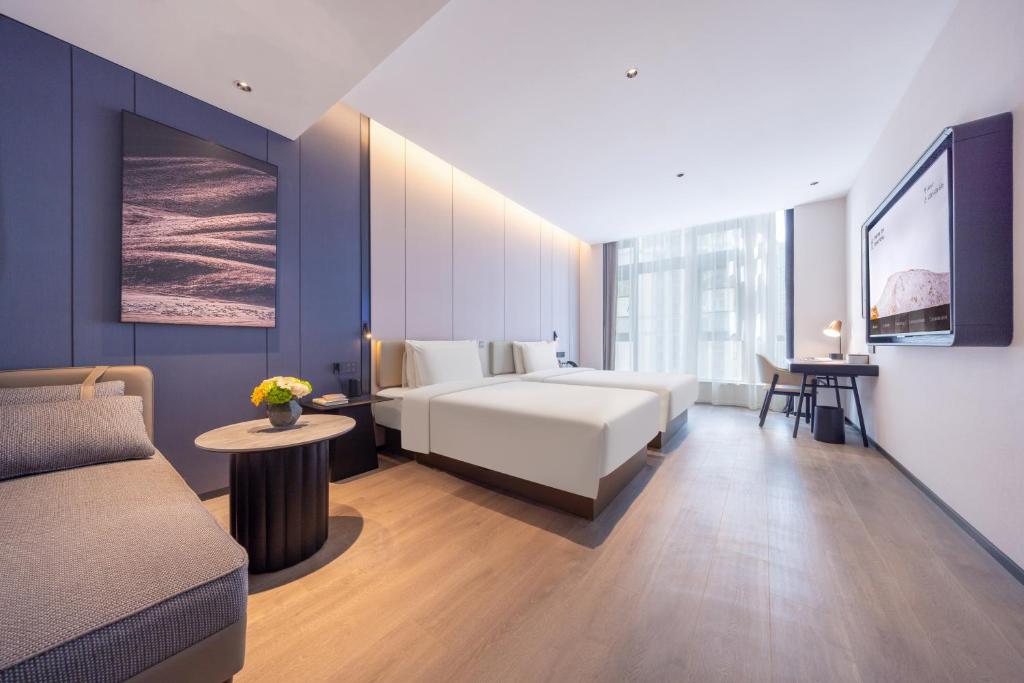 Postel nebo postele na pokoji v ubytování Atour Hotel Changsha Financial Center Chazishan Road
