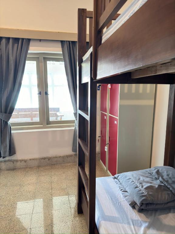 Postel nebo postele na pokoji v ubytování Ijen Haus