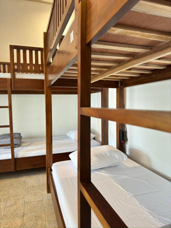 Postel nebo postele na pokoji v ubytování Ijen Haus