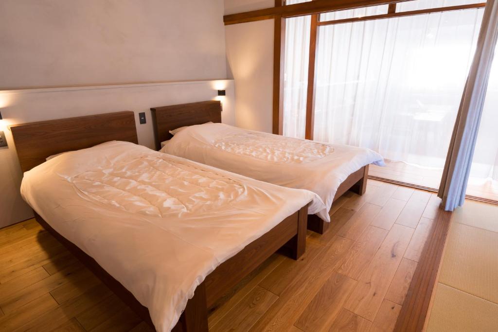Postel nebo postele na pokoji v ubytování GuestHouseYULLAT