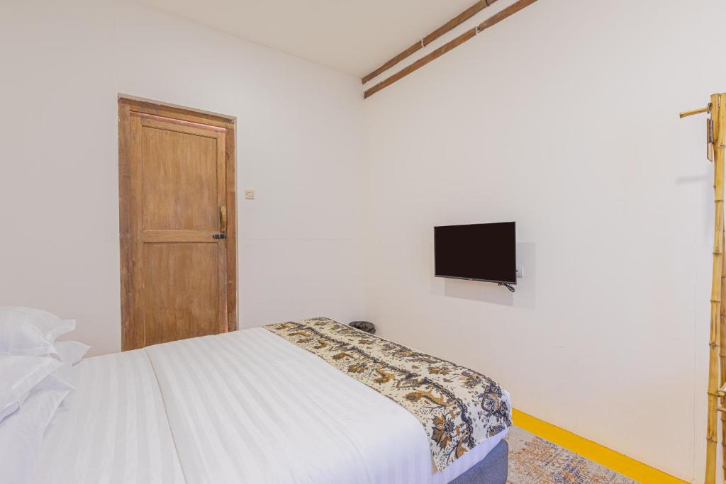 TV a/nebo společenská místnost v ubytování Yukke Tembi Homestay