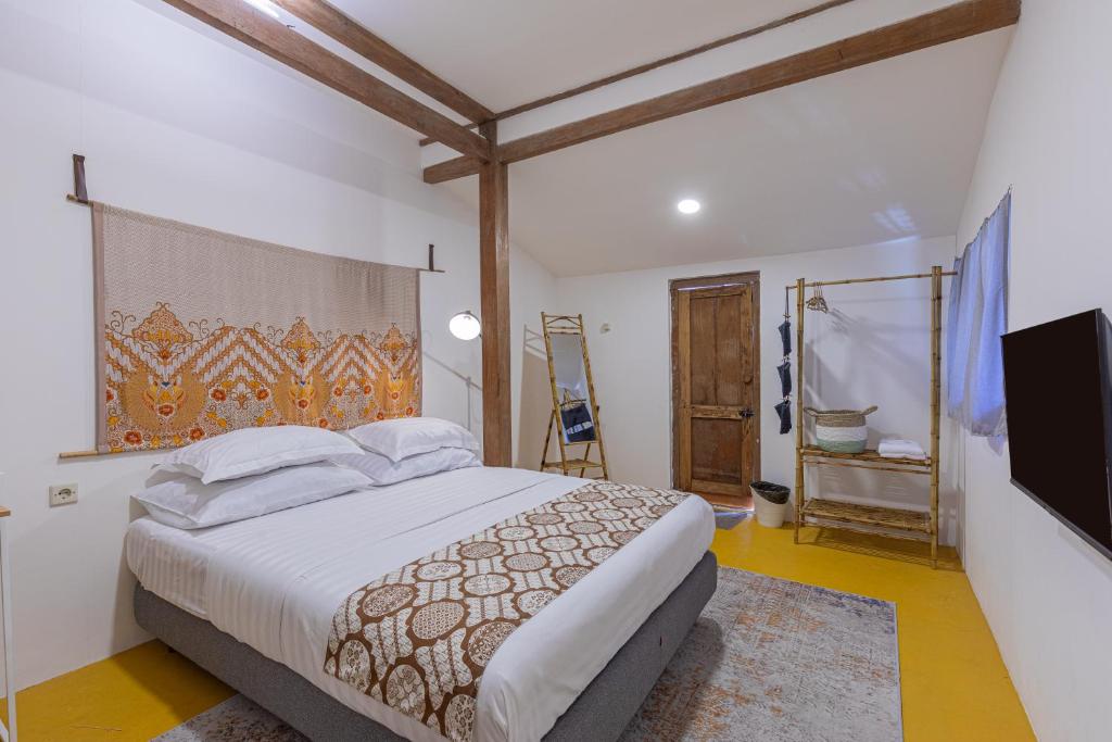 Postel nebo postele na pokoji v ubytování Yukke Tembi Homestay