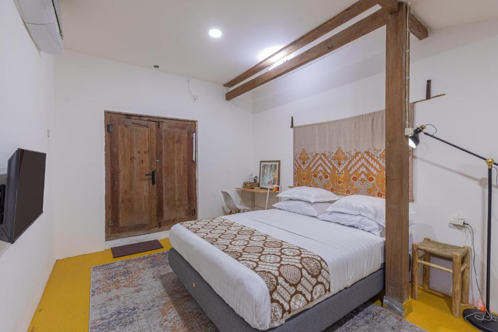Postel nebo postele na pokoji v ubytování Yukke Tembi Homestay