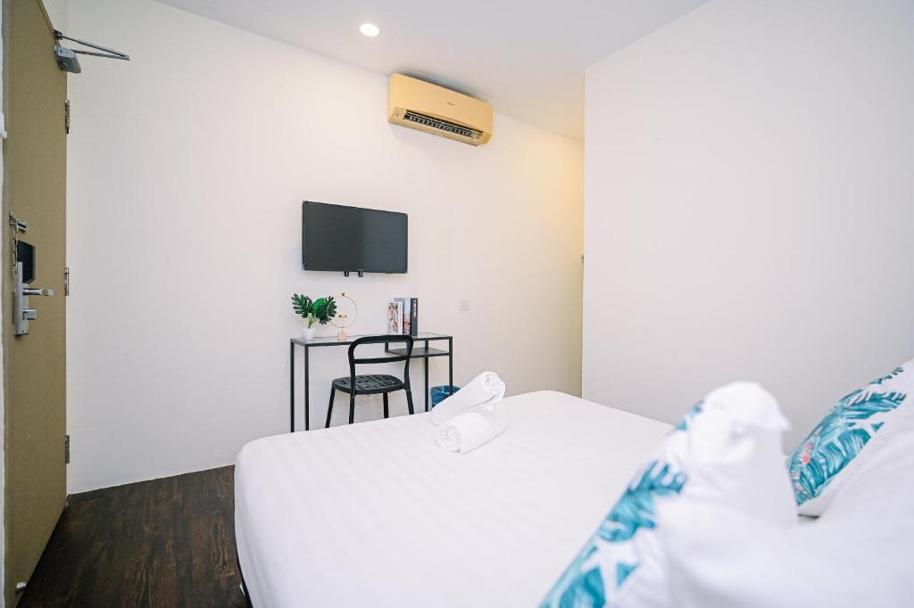 Postel nebo postele na pokoji v ubytování Swing & Pillows - Z Hotel Cyberjaya