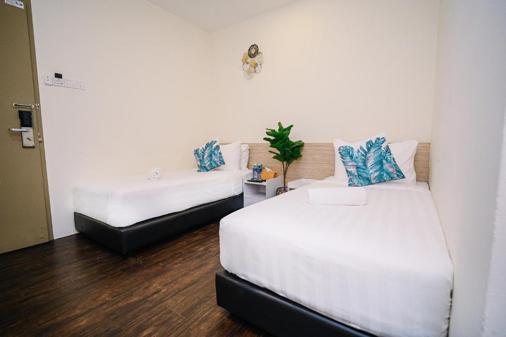 Postel nebo postele na pokoji v ubytování Swing & Pillows - Z Hotel Cyberjaya
