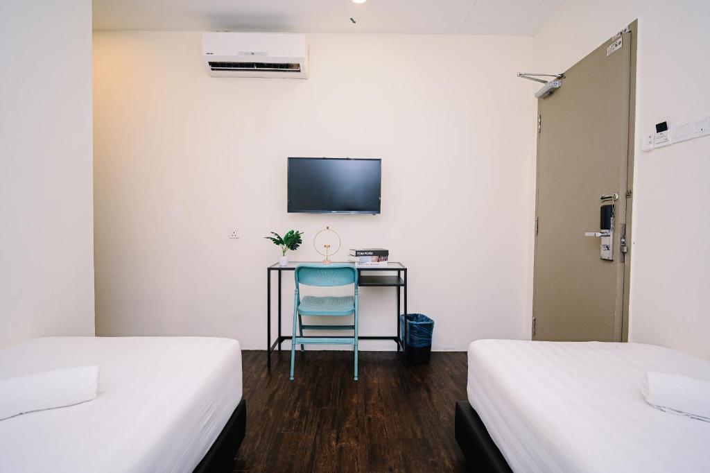 Postel nebo postele na pokoji v ubytování Swing & Pillows - Z Hotel Cyberjaya
