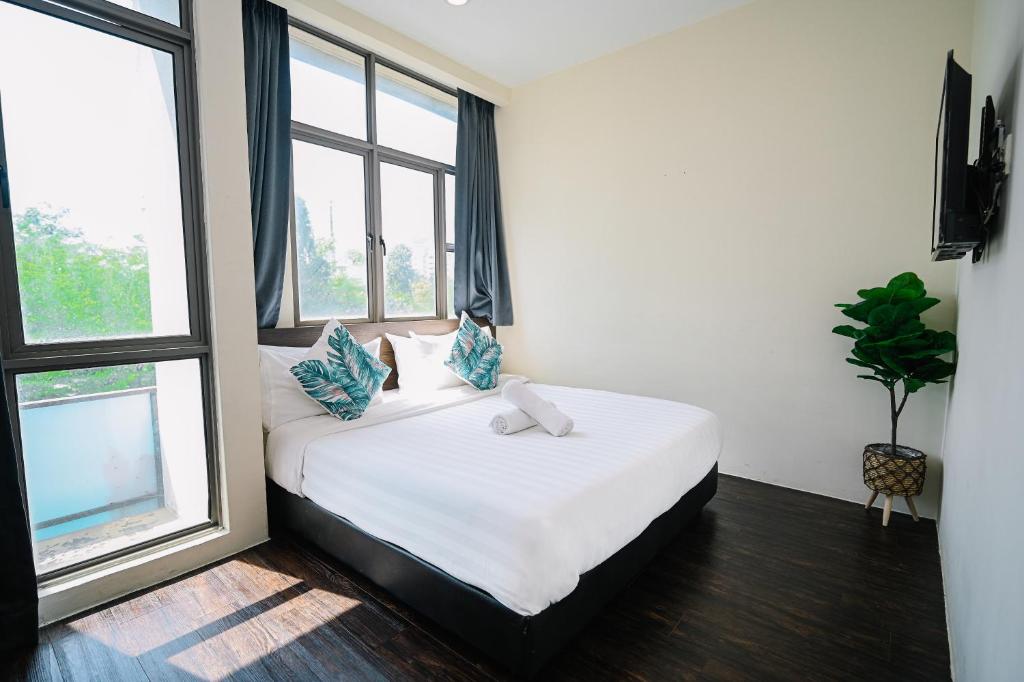 Postel nebo postele na pokoji v ubytování Swing & Pillows - Z Hotel Cyberjaya