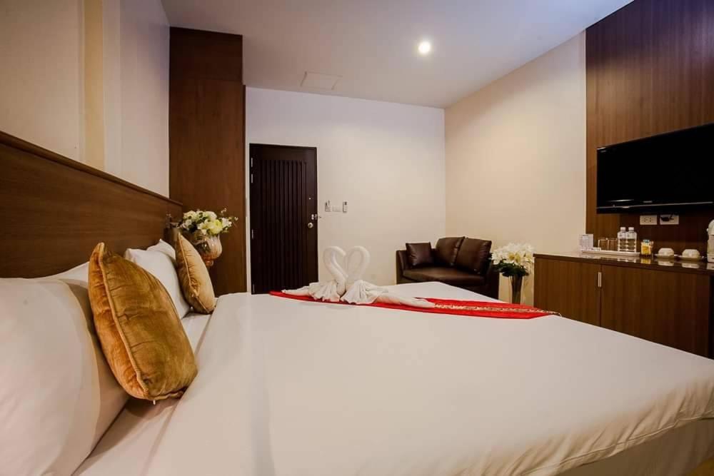 Postel nebo postele na pokoji v ubytování Royal Waves Hotel