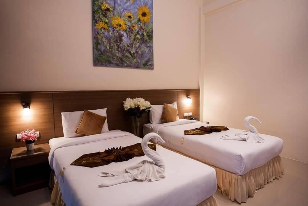 Postel nebo postele na pokoji v ubytování Royal Waves Hotel