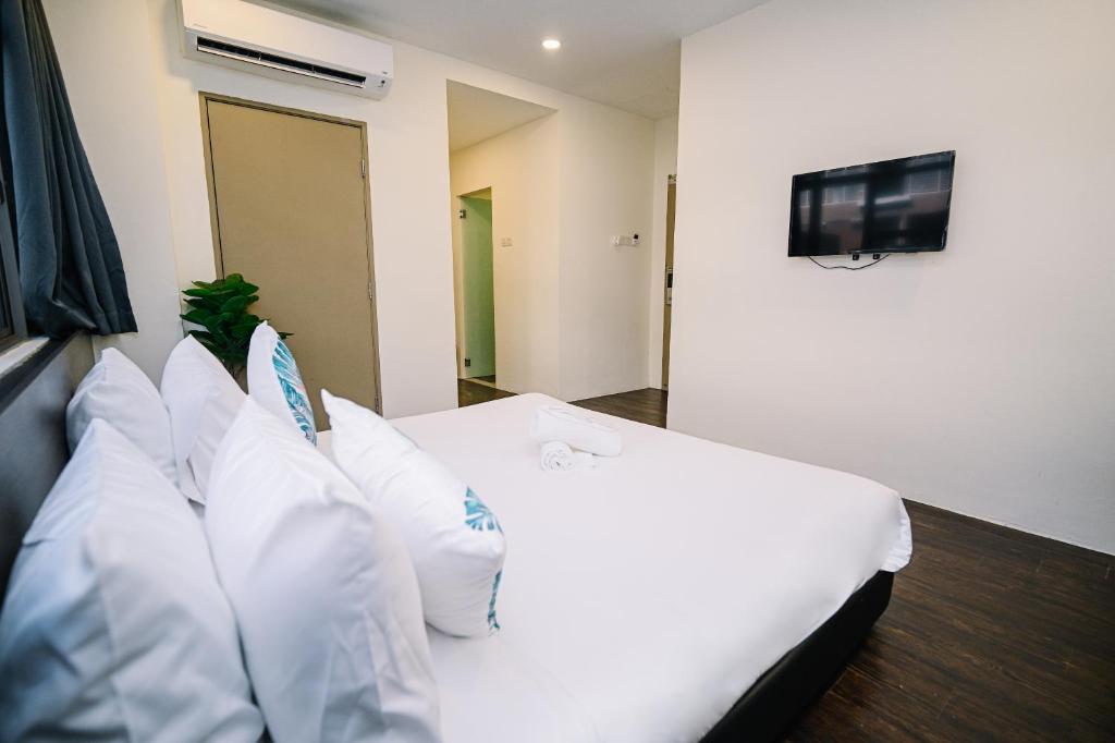 Postel nebo postele na pokoji v ubytování Swing & Pillows - Z Hotel Cyberjaya