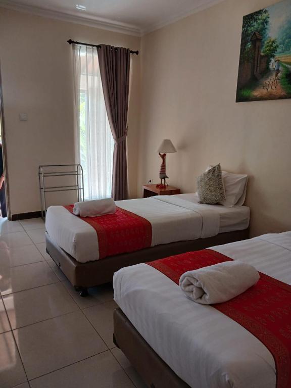 Postel nebo postele na pokoji v ubytování Semaya Homestay