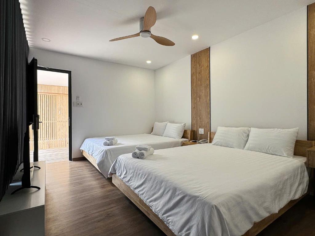 Postel nebo postele na pokoji v ubytování Wanderlust garden inn