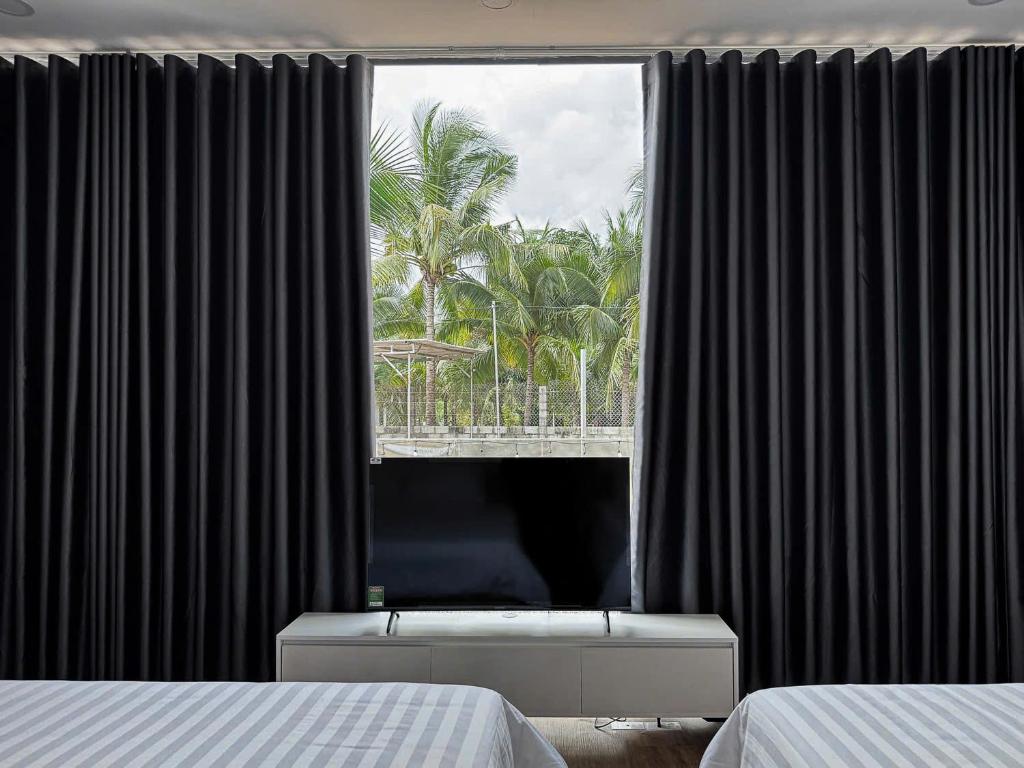 Giường trong phòng chung tại Wanderlust garden inn