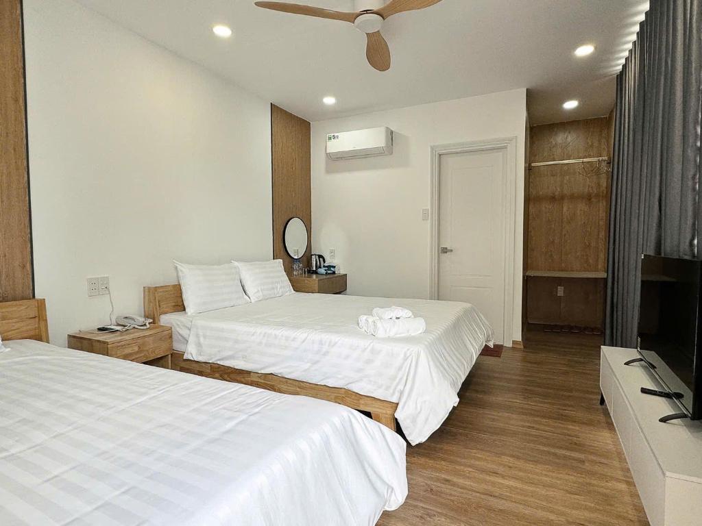 Postel nebo postele na pokoji v ubytování Wanderlust garden inn