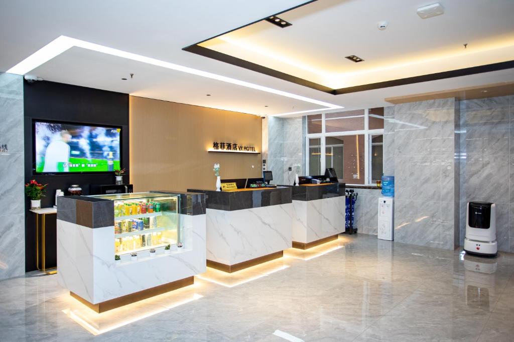 Kuchyň nebo kuchyňský kout v ubytování VX Hotel Shanghai Yixian Road Dabaishu