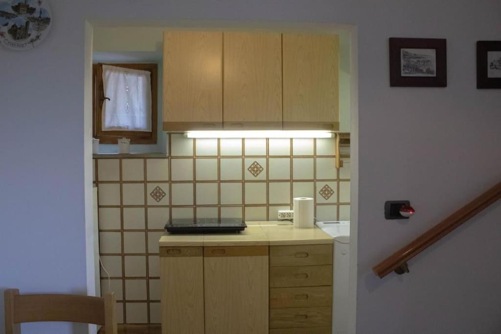 a kitchen with a sink and a counter top at Casa San Donato in San Donato in Fronzano