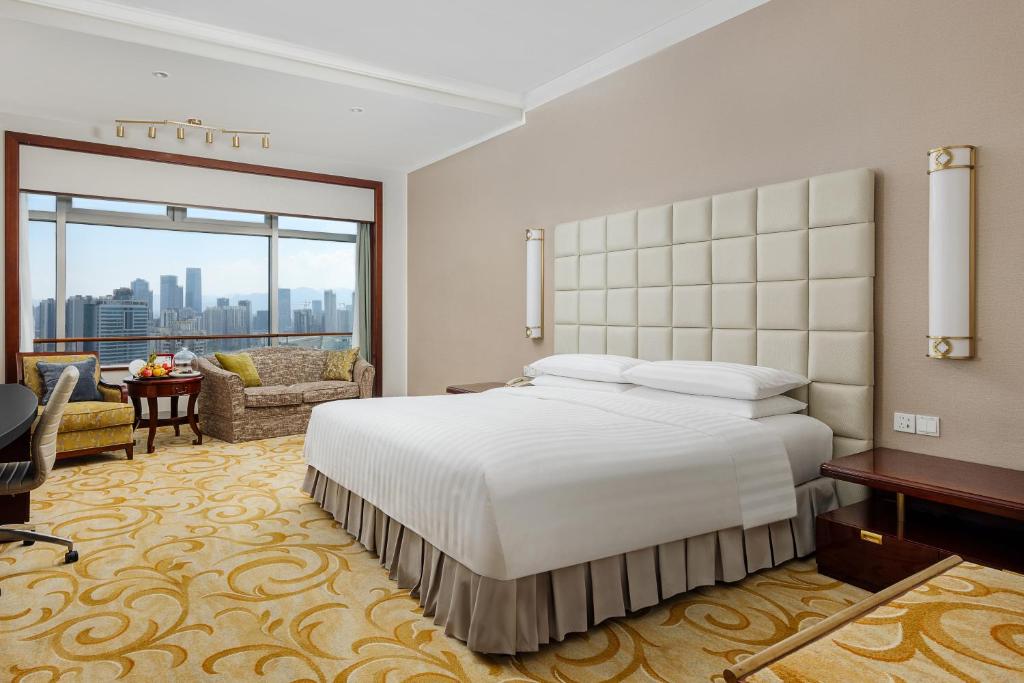 Postel nebo postele na pokoji v ubytování Shangri-La Fuzhou