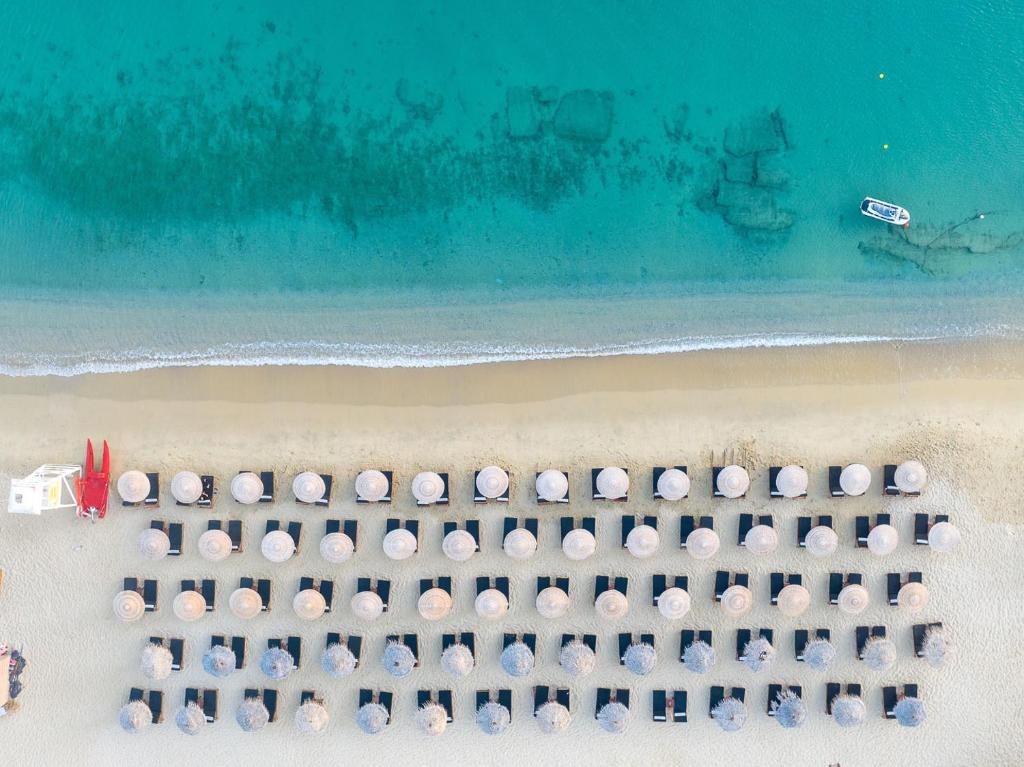 an aerial view of a beach with umbrellas at Arte & Mare Elia Luxury Suites and Villas in Elia Beach