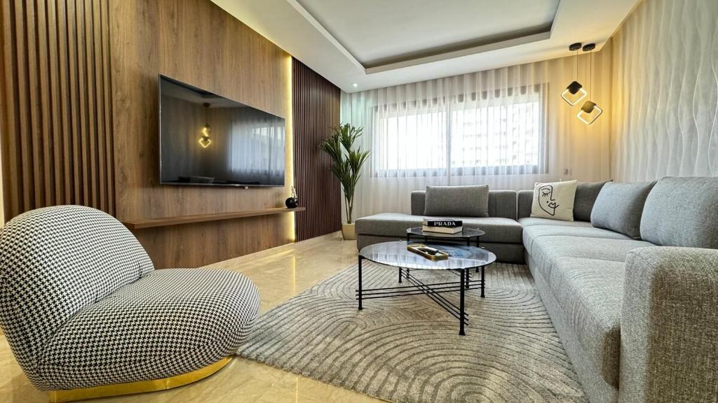 a living room with a couch and a table at Casa Streets 3 BR Terrace - AppartAli Luxury Platform in Casablanca
