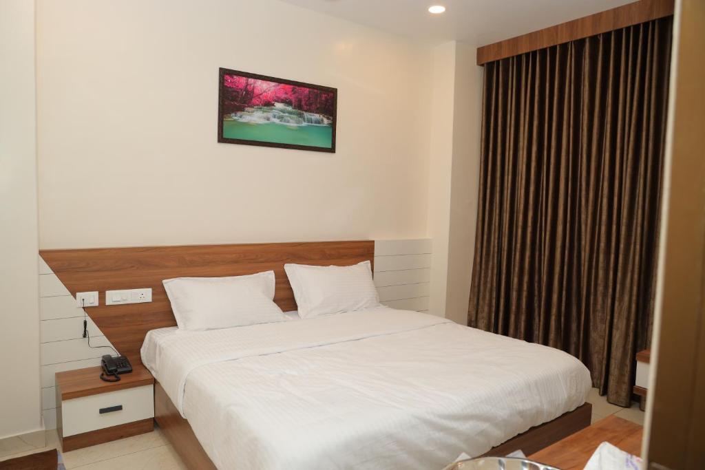 Postel nebo postele na pokoji v ubytování Hotel BR Grand
